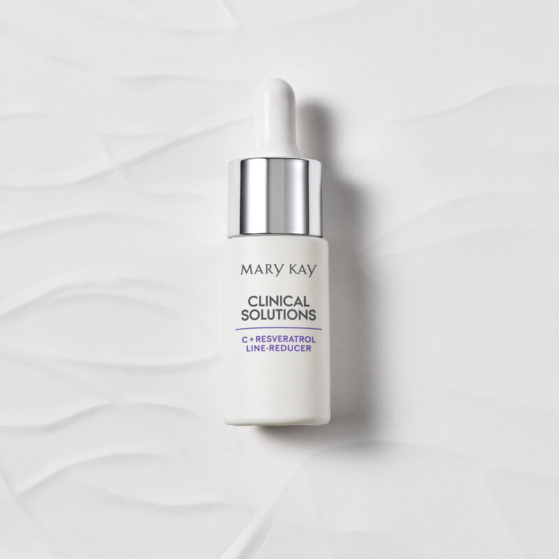 Closed bottle of Mary Kay Clinical Solutions C + Resveratrol Line-Reducer on textured background