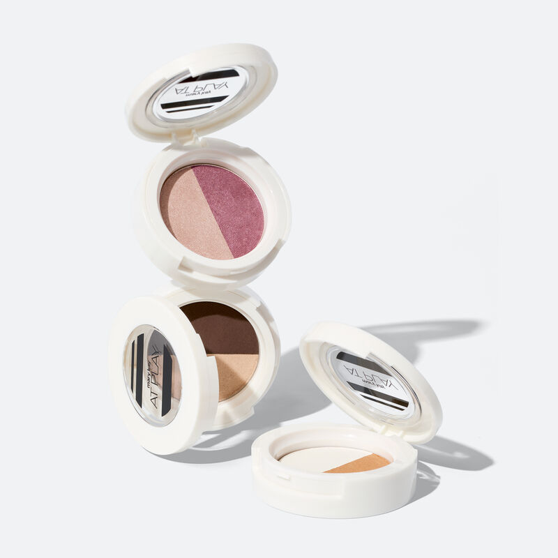 Open special-edition Mary Kay Eye Shadow Duo in Rosy Plum stacked on Choco Espresso compact with Gold Star compact to the right on white background image number null