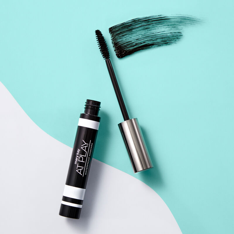 Open tube of Mary Kay At Play Waterproof Mascara with accompanying wand and product rub