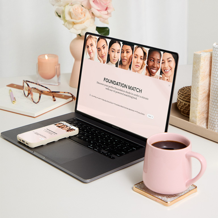 A laptop & a mobile phone, on which you can see the Foundation Matching Tool on their respective screens.