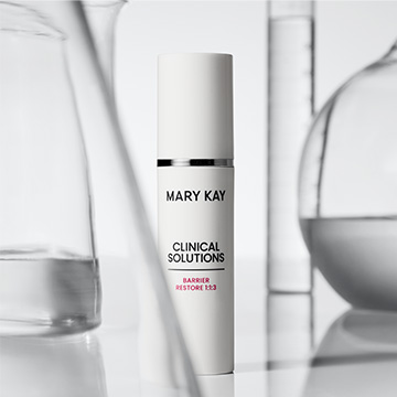 Bottle of Mary Kay Clinical Solutions Barrier Restore 1:1:3 surrounded by glass beakers