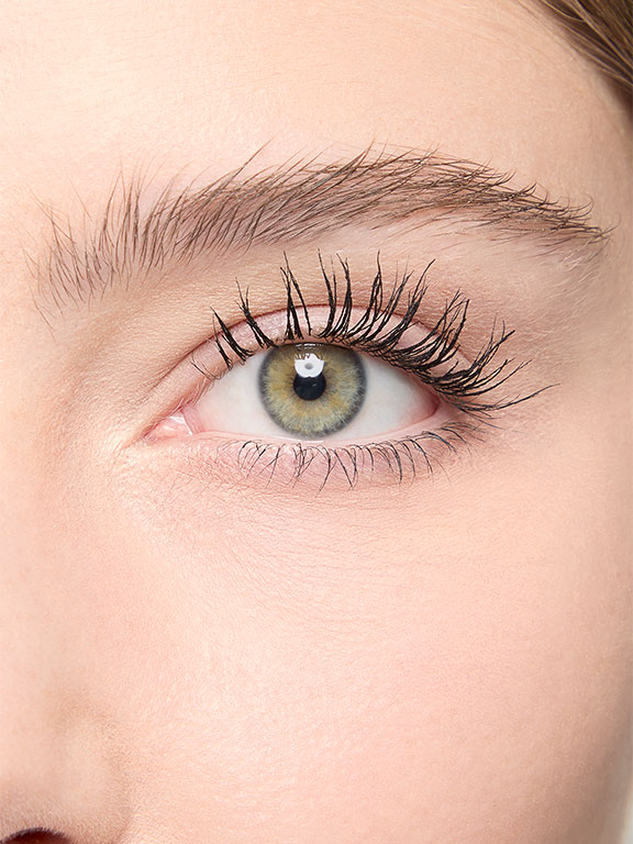 Close up shot of model with light skintone showing eyelashes after Mary Kay Great Heights Mascara application